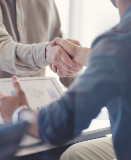 Close up of Businessmen shaking hands.